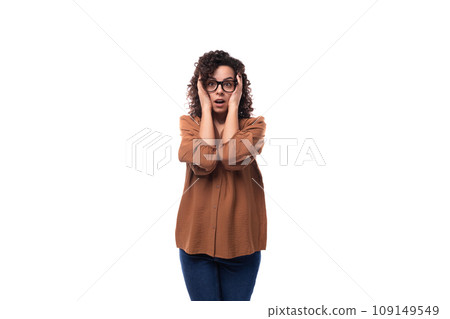 young caucasian lady with curly hair surprised on white background with copy space young caucasian lady with curly hair surprised on white background with copy space 109149549