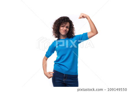 young strong woman in a blue sweater with curly hair 109149550