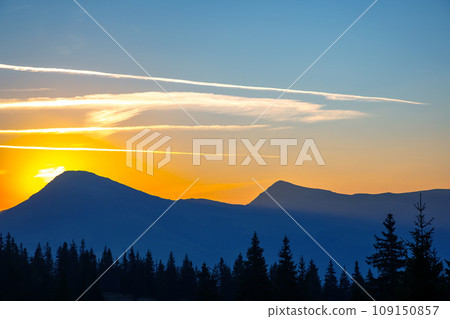 Morning sunrise over the top of a mountain in the Ukrainian Carpathians 109150857