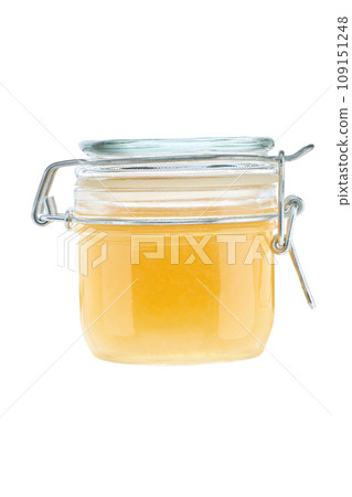 front view of small ginger jam jar without labels and shiny metallic lid covers isolated on white background. front view of small ginger jam jar without labels and shiny metallic lid covers isolated on white background. 109151248
