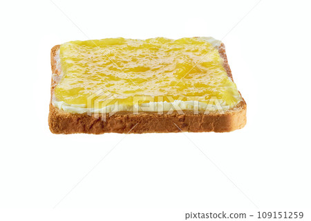 Toast with lemon jam and butter isolated on white background. With clipping path. Toast with lemon jam and butter isolated on white background. With clipping path. 109151259