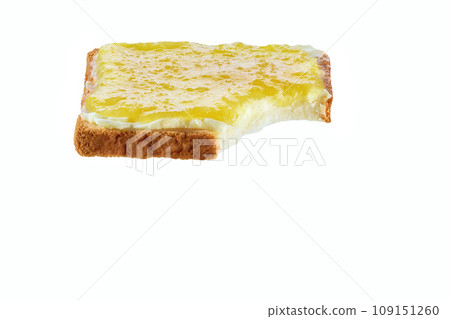 Take a bite toasted bread with lemon jam, isolated on a white. Bitten toast with lemon jam on white background. Take a bite toasted bread with lemon jam, isolated on a white. Bitten toast with lemon jam on white background. 109151260