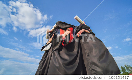College graduates embrace in a circle. College graduates embrace in a circle. 109151417