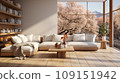 Interior of stylish spacious living room in luxury cottage. Comfortable corner sofa with cushions, rustic wooden coffee table, bookshelves on the wall, panoramic windows overlooking scenic landscape. 109151942