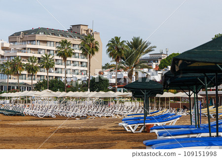 Nobody on the beach and empty sun loungers in Avsallar, Alanya, Turkey. Nobody on the beach and empty sun loungers in Avsallar, Alanya, Turkey. 109151998