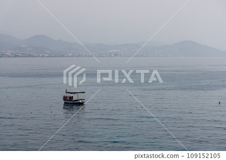 Fishing boat in the sea near the shore near Alanya, Turkey. 109152105
