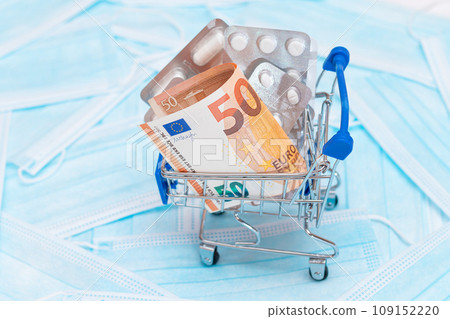 Pills and Capsules in Shopping Cart on the Surgical Masks 109152220