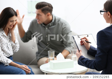 Professional psychologist working with couple in office 109152265