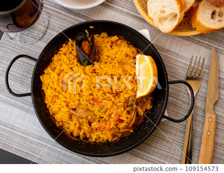 Just cooked paella de marisco on table 109154573