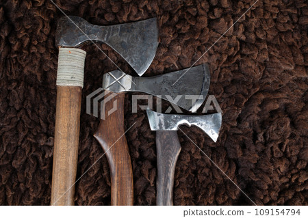Vintage axes on sheep fur Vintage axes on sheep fur 109154794
