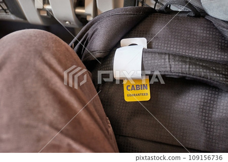 Cabin bag in front of seat on economy class flight 109156736