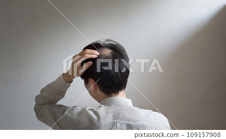 A man who cares about his hair (AI generated image) 109157908