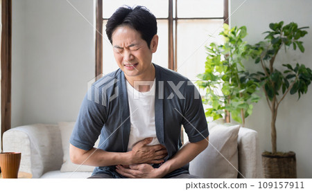 A man suffering from abdominal pain (AI generated image) 109157911