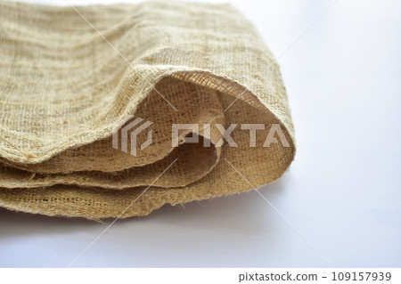 brown sackcloth texture background, folded burlap fabric textile for design brown sackcloth texture background, folded burlap fabric textile for design 109157939
