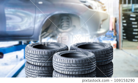 Car tires pile in a car service center or auto tire shop , Car tire shop and maintenance concept Car tires pile in a car service center or auto tire shop , Car tire shop and maintenance concept 109158290