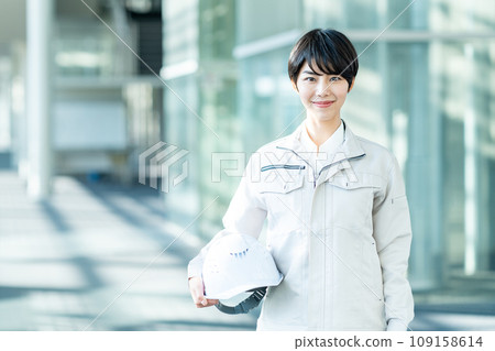 Woman dressed in work clothes 109158614