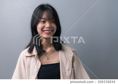 Happy Asian Teen Girl in Closeup Portrait on background. Happy Asian Teen Girl in Closeup Portrait on background. 109158834