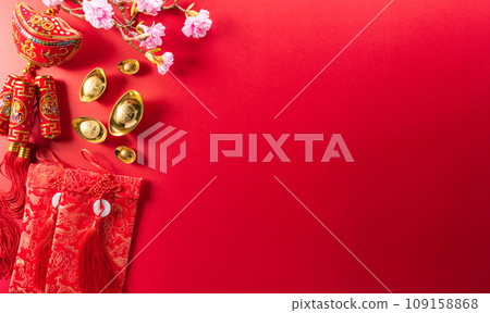 Chinese new year decorations made from red packet, orange and gold ingots or golden lump on a red background. Chinese characters FU in the article refer to fortune good luck, wealth, money flow. Chinese new year decorations made from red packet, orange and gold ingots or golden lump on a red background. Chinese characters FU in the article refer to fortune good luck, wealth, money flow. 109158868