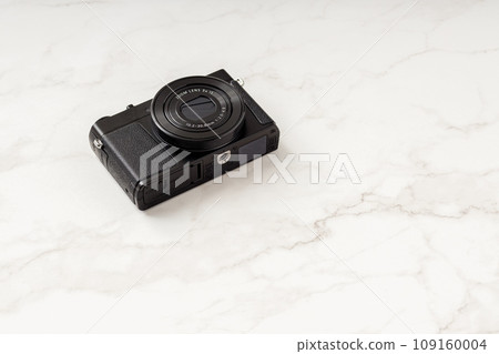 Black compact digital camera | White background Black compact digital camera | White background 109160004