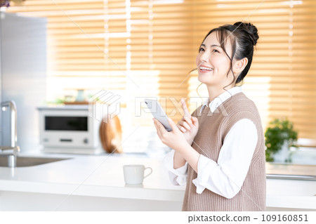 A young woman using a smartphone. A young woman using a smartphone. 109160851