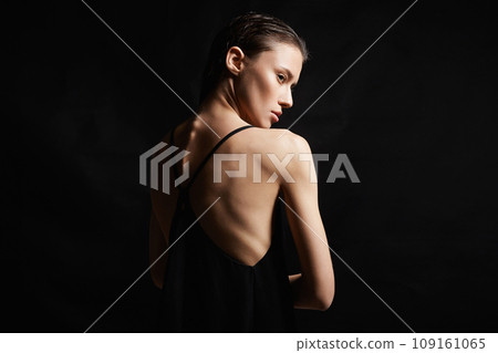 young woman with wet Hair. Beautiful sexy model Girl in black Dress young woman with wet Hair. Beautiful sexy model Girl in black Dress 109161065