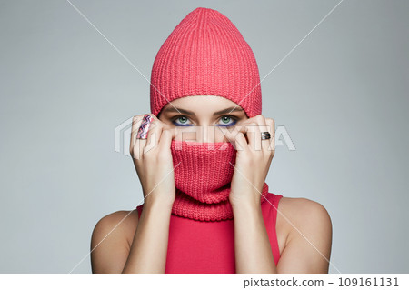 girl in red balaclava. New Hat style. Trendy Pink Mask on pretty woman 109161131
