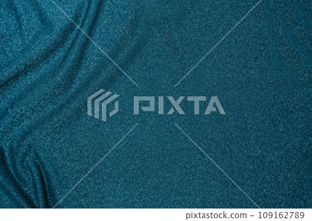 Background of draped dark green fabric with silver lurex thread Background of draped dark green fabric with silver lurex thread 109162789
