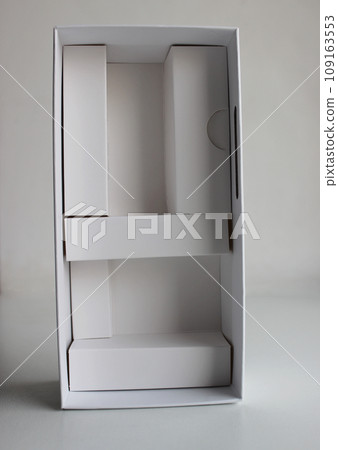 White Cardboard Container With Partitions, Reminiscent Of A Wardrobe Mockup White Cardboard Container With Partitions, Reminiscent Of A Wardrobe Mockup 109163553