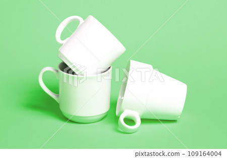 White coffee cups isolated on a solid background White coffee cups isolated on a solid background 109164004