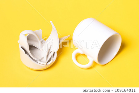 Broken cup isolated on a solid background Broken cup isolated on a solid background 109164011