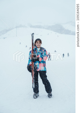 Young woman playing Ski in winter season. Snow winter activity concept Young woman playing Ski in winter season. Snow winter activity concept 109164095