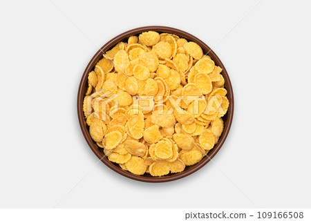Bowl of cornflakes on a white background. Top view 109166508
