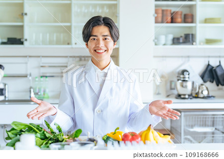 Male researcher showing vegetables and fruits, registered dietitian Male researcher showing vegetables and fruits, registered dietitian 109168666