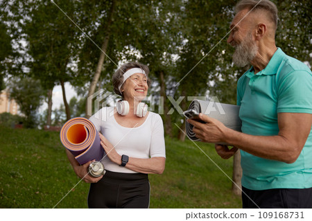 Happy old friends with sports mat having fun together before sport workout 109168731