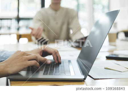 Businessman is analyzing investment project data from data report. 109168843