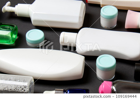 Group of plastic bodycare bottle Flat lay composition with cosmetic products on colored background empty space for you design. Set of White Cosmetic containers, top view with copy space Group of plastic bodycare bottle Flat lay composition with cosmetic products on colored background empty space for you design. Set of White Cosmetic containers, top view with copy space 109169444