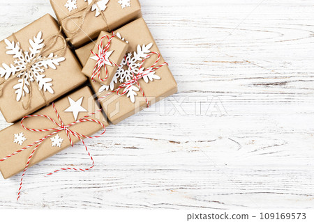 Christmas wooden background with gift boxes and decor. Top view with copy space for your text 109169573