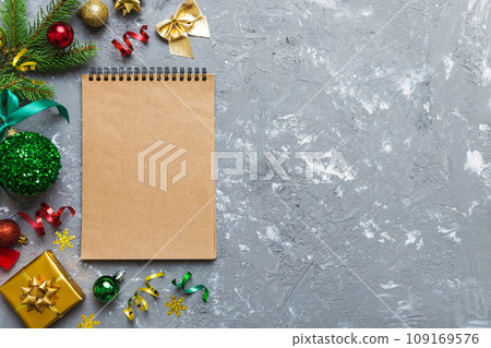 Christmas blank greeting card mock-up scene. Creative layout made of Christmas tree branches and paper card note. Flat lay. Nature New Year concept 109169576