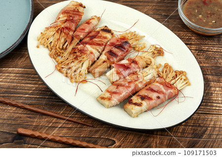 Enoki mushroom appetizer fried in bacon 109171503