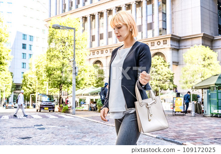 Blonde woman walking in Italy 109172025