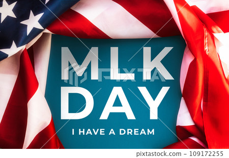 Blue background framed with American Flag and text abbreviation MLK. Happy Martin Luther King Day concept Blue background framed with American Flag and text abbreviation MLK. Happy Martin Luther King Day concept 109172255
