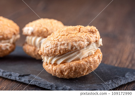 Close-up of coconut cream cookies on a mica serving board. Close-up of coconut cream cookies on a mica serving board. 109172990