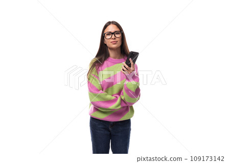 young cheerful charming caucasian woman with straight black hair dressed in a stylish autumn striped young cheerful charming caucasian woman with straight black hair dressed in a stylish autumn striped 109173142