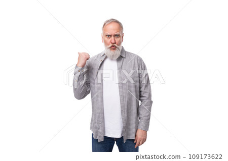 a cute grandfather with a white beard and mustache is wearing a striped shirt over a t-shirt 109173622