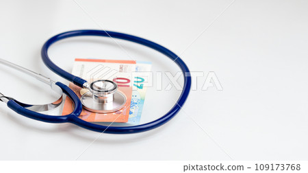 Stethoscope on euro paper money bank notes with copy space Stethoscope on euro paper money bank notes with copy space 109173768