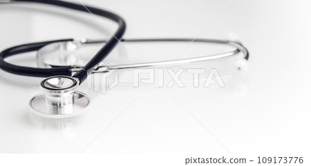 Stethoscope on white glass table with copy space. Healthcare and medical concept. 109173776