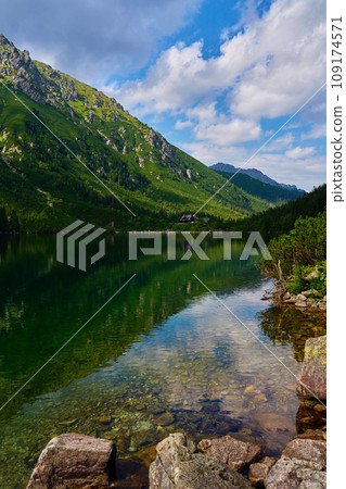 Mountains range near lake at summer day 109174571