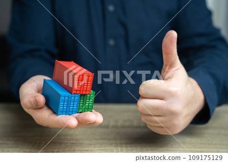 Shipping containers and a thumbs up gesture seal of approval. Conclude a trade agreement. Achieve success in signing a contract for the sale of goods. High rates of cargo transportation volumes 109175129