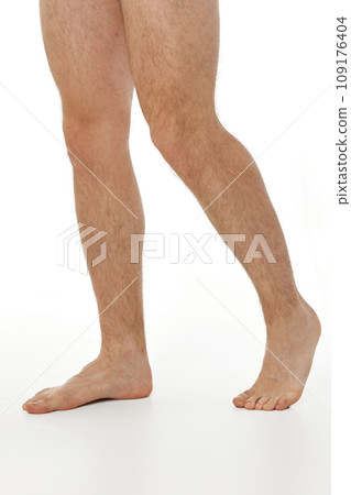 Barefoot male legs on white background. Body care concept. 109176404