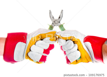 gloved hand with pliers 109176975